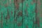 Wooden planks painted green.