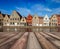 Wooden planks table with European town in