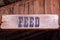 Wooden plate above an entry into a barn