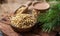 A wooden plate with pine nuts, a pine branch with long needles, a jar of nuts, the background is blurred.