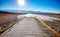 Wooden platform at the Badwater Basin at sunset, USA.