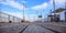 Wooden platform for boardwalk at limassol pier, cyprus. Blue sky with white clouds for background.