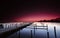 Wooden platform at dawn in a calm lake