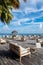 Wooden platform overlooking the ocean with tables and sofas, restaurant in a luxury resort, tropical paradise, Maldives