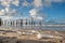 Wooden poles at the beach near Petten aan Zee, Holland