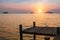 Wooden pontoons on sea coast during sunset. Nature.