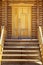 Wooden porch, door and staircase in a log frame house. The ancient technology of building a Russian log hut and churches