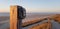 Wooden post with a lamp guiding the way down to the beach near egmonad aan zee, northern holland.