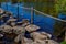 Wooden posts and rope fences, stepping stones at Brug Molenplas over the Oude Maas river