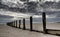 Wooden posts at the seashore in northern Wales