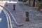 Wooden posts set in the pavement at Nether Stowey in Somerset to prevent cars parking or driving on the pavement