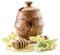 Wooden pot full of fresh linden honey and linden flowers