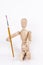 Wooden puppet holding painting brush