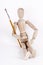 Wooden puppet holding painting brush