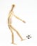 Wooden puppet playig football