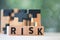 Wooden puzzle put on `RISK` word.