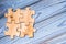 Wooden puzzles on a blue wooden background.