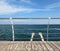 Wooden quay and man`s hands