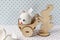 Wooden rabbit carrying a cart with an egg with bunny ears and a muzzle. Eggshell with a hatched chick