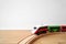 Wooden railway and train at home on the floor. Creative play toys