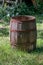 Wooden rain barrel in an outdoors setting