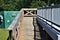 Wooden Ramp Leading to Metal Dock Near Electrical Junction Box