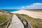 Wooden ramp with railing down to the Zahora Beach