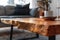 Wooden rectangle table with candle on it in living room interior design