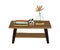 Wooden rectangular coffee table with vase, books and magazines for home interior design. Modern stylish wood furniture