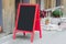 Wooden red restaurant signboard with place for text on the street ad advert advertising food menu poster bigboard placard empty bl