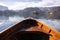 Wooden rent boat on a Bled lake, end of the boat facing towards Lake Bled island with copy space- famous tourist