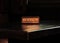 Wooden reserved sign with capital letters on dining table in restaurant