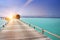 The wooden road over the sea to traditional lodges on piles