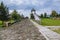 A wooden road paved with thick logs leads to the observation tower