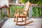 Wooden rocking chair on the terrace of an exotic