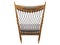 Wooden rocking chair with textile seat and headrest. 3d render