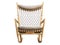 Wooden rocking chair with textile seat and headrest. 3d render