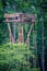 Wooden rope climbing tower for recreation in the woods