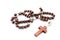 Wooden rosary on white
