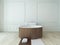 Wooden round bathtub against white wall