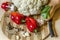 Wooden round chopping board with cauliflower, pumpkin, sweet red pepper with spices