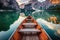 Wooden rowing boat on scenic lake with mountains in background. Generative AI