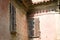 Wooden ruined windows in a an old building with wooden shutters Fiorenzuola di Focara, Italy, Europe