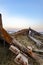 Wooden ruins near a beach under a clear sky