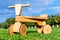 Wooden runbike on the grass field outdoors