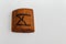 Wooden rune which means Man lie on a table on a white background