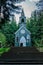 Wooden rural chapel called Tichackova kaple in Broumovsko region,Czech republic.Catholic church in spring countryside.Religious