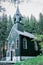 Wooden rural chapel called Tichackova kaple in Broumovsko region,Czech republic.Catholic church in spring countryside.Religious