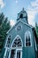 Wooden rural chapel called Tichackova kaple in Broumovsko region,Czech republic.Catholic church in spring countryside.Religious