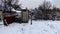 Wooden rural toilet in winter evening